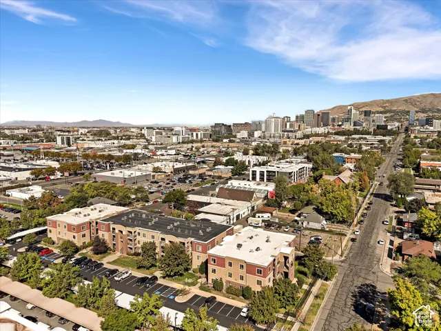 Multi-story residential buildings with covered parking and mature landscaping