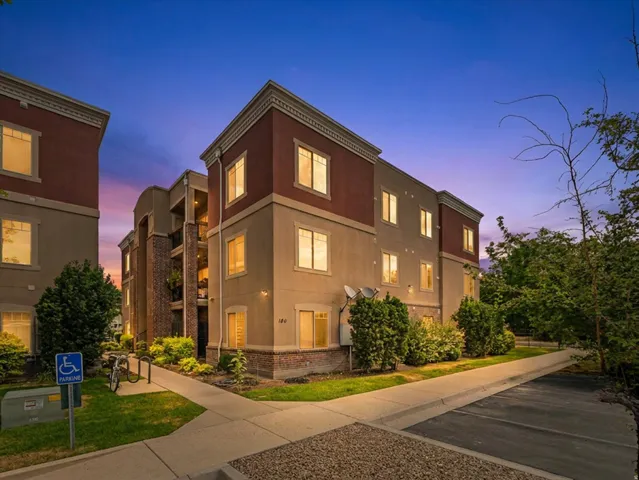 Multi-story building featuring a stucco and brick facade with decorative trim