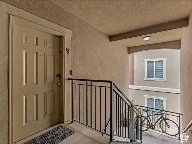 Entryway featuring a panel door with smart lock hardware