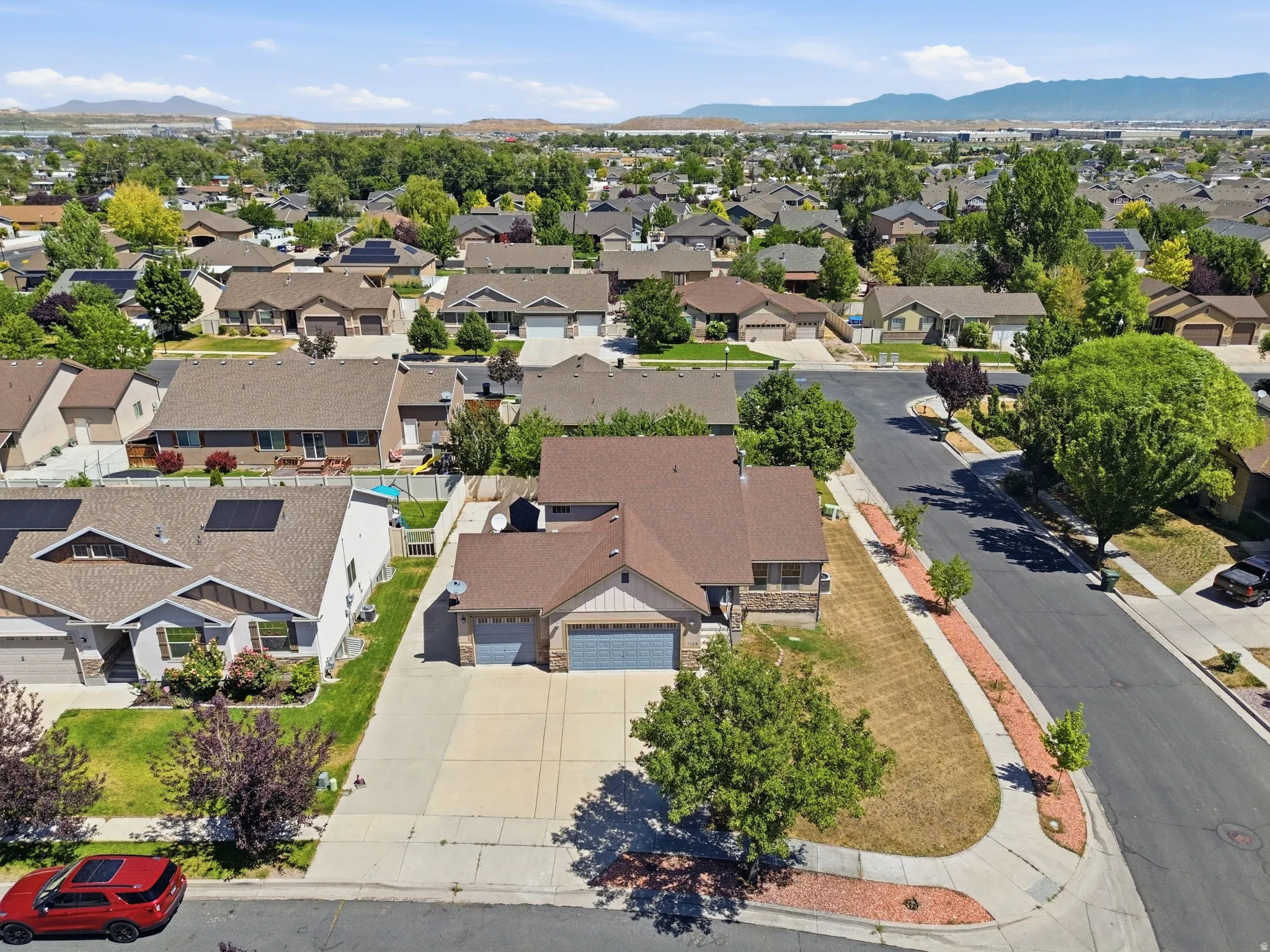 Residential neighborhood with diverse home styles and mature trees