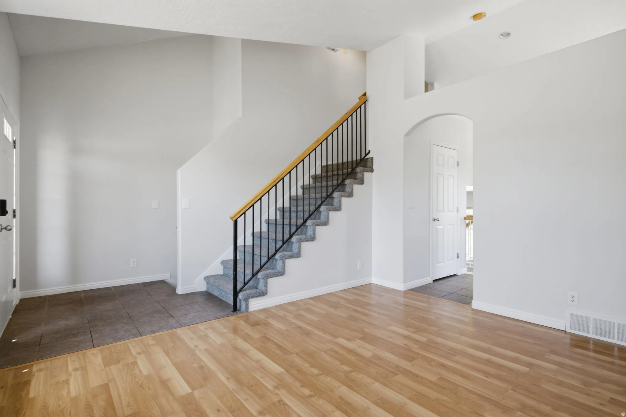 Light wood-finish flooring extending into the main living area
