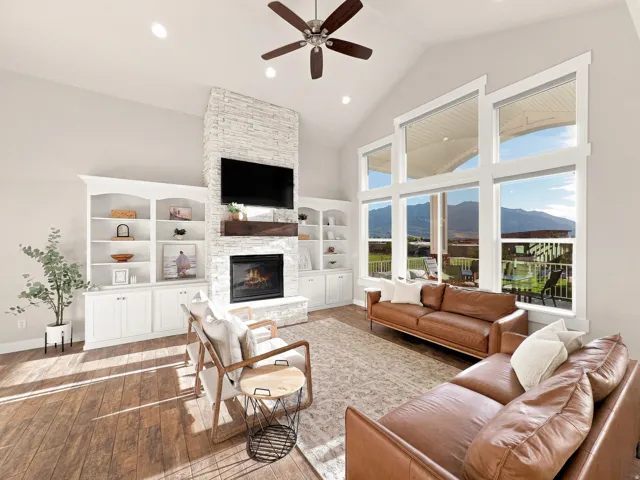 Vaulted ceiling with a ceiling fan and recessed lighting