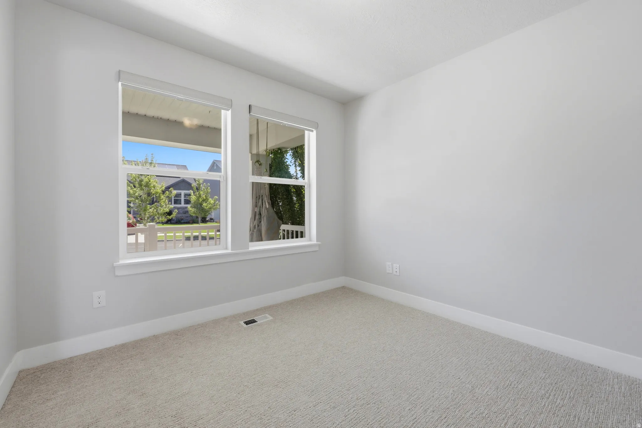 Light gray wall finishes with white trim