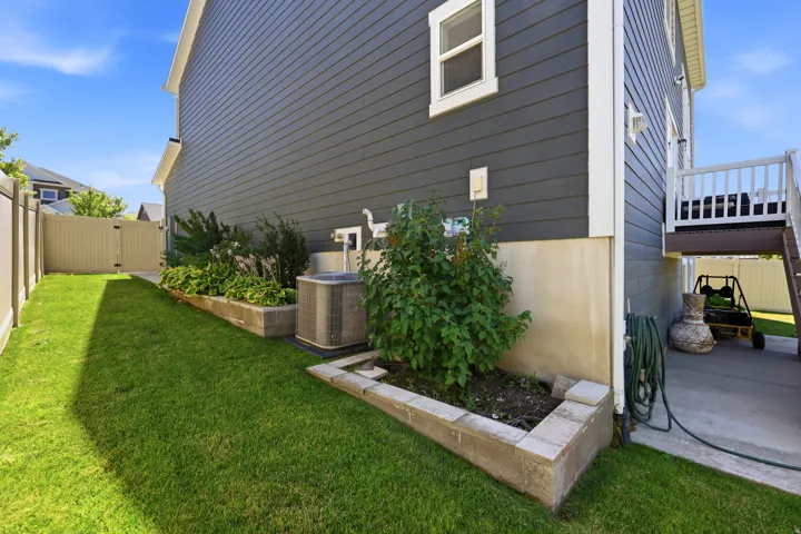Exterior siding in a dark gray horizontal paneling finish with white trim