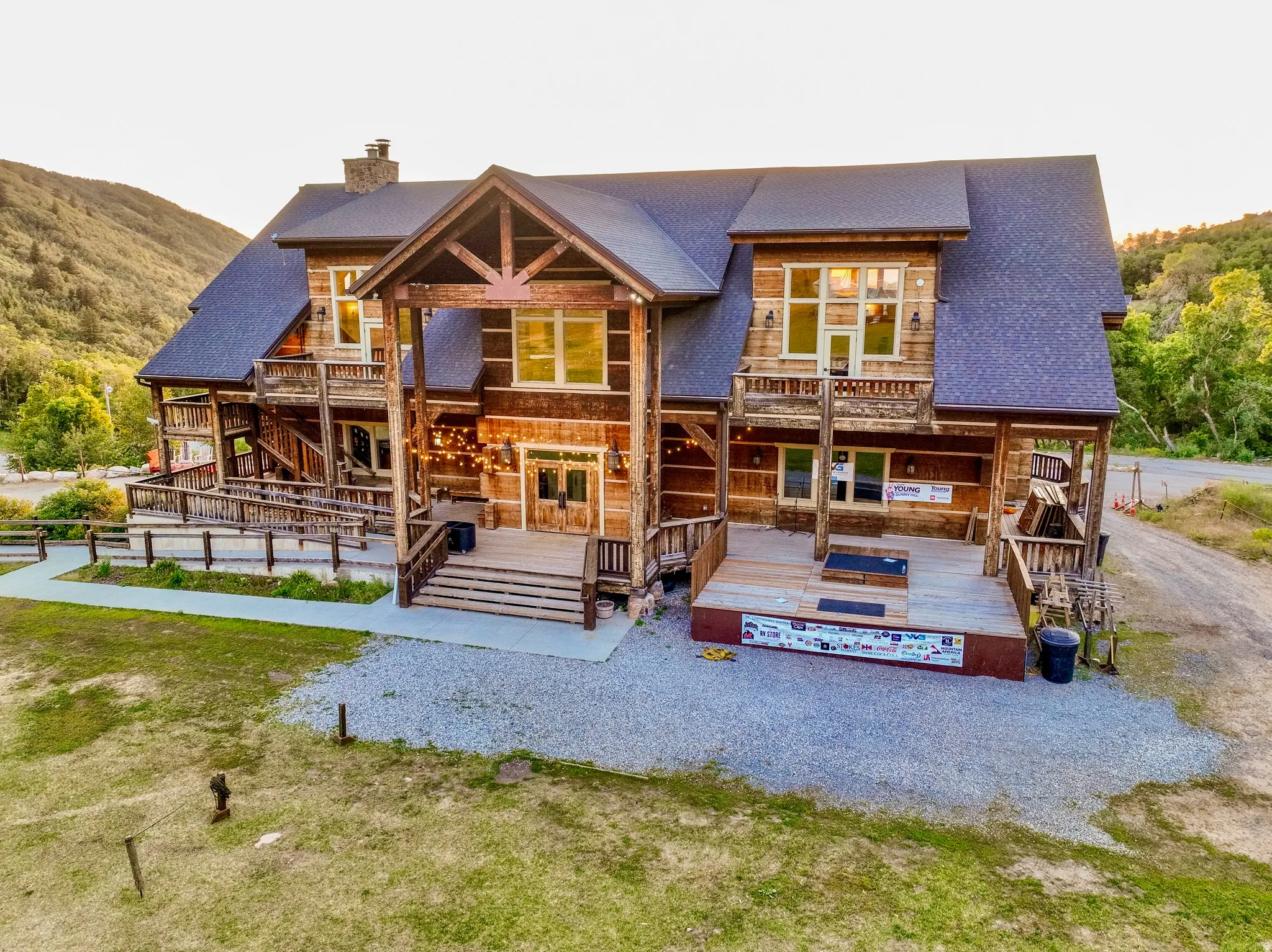Expansive log cabin-style property featuring multiple balconies and covered porches