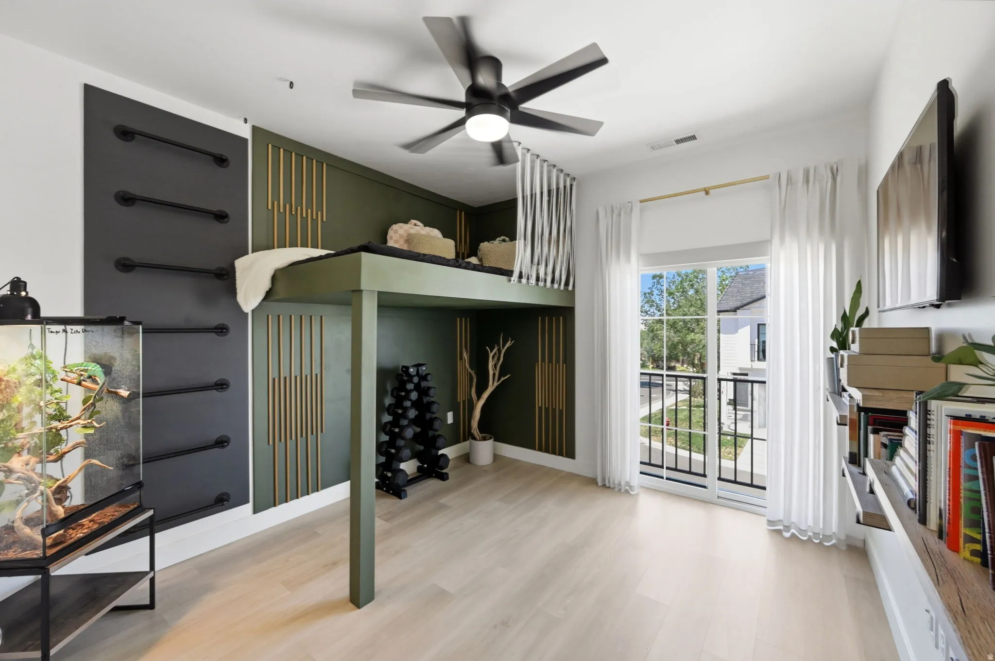 Room featuring a built-in loft bed and a ceiling fan