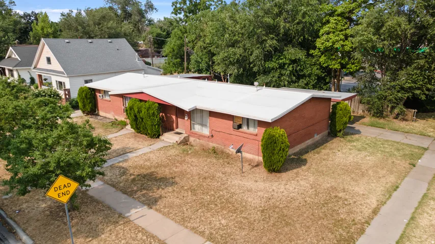 Brick exterior with a white roof