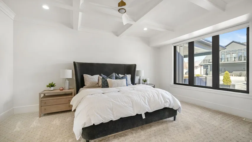Bedroom featuring a coffered ceiling, recessed lighting, and a modern ceiling fan