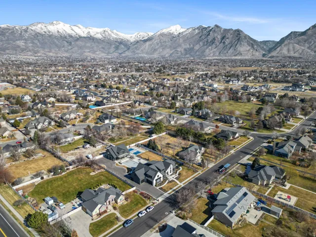 Expansive residential area with a prominent snow-capped mountain range backdrop