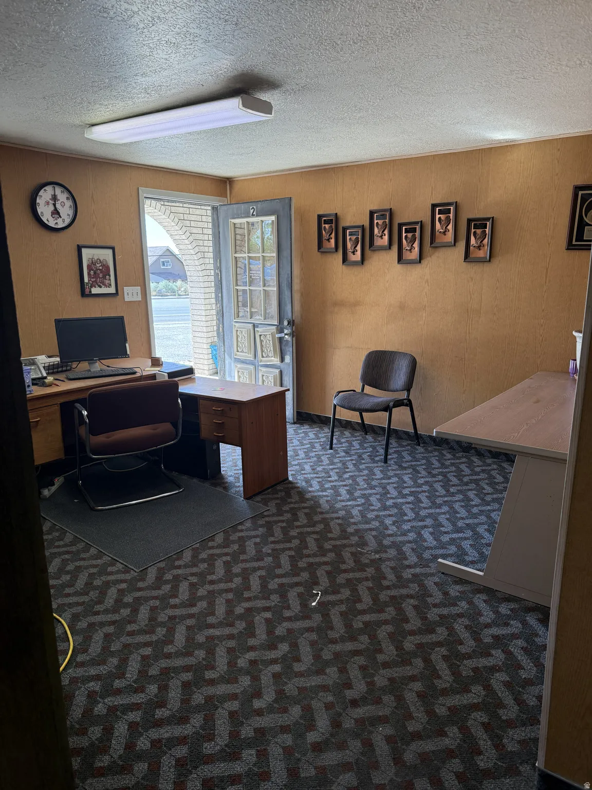 Textured carpet flooring with a repeating geometric pattern