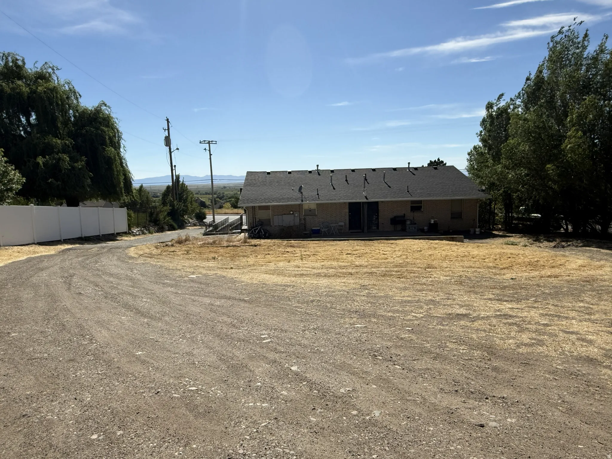 Spacious gravel driveway with ample parking