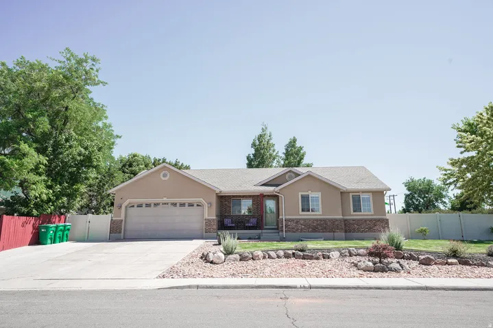 Tan stucco exterior with stone veneer accents