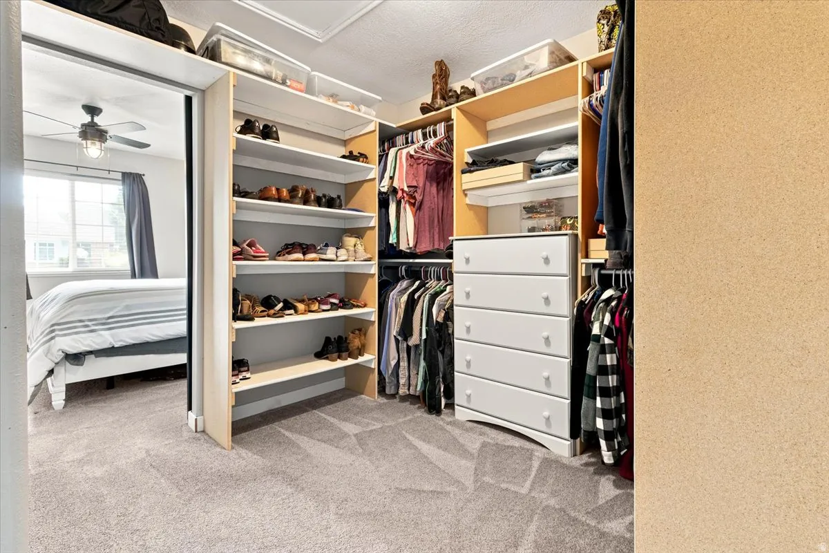 Large custom walk-in closet with sliding barn doors.