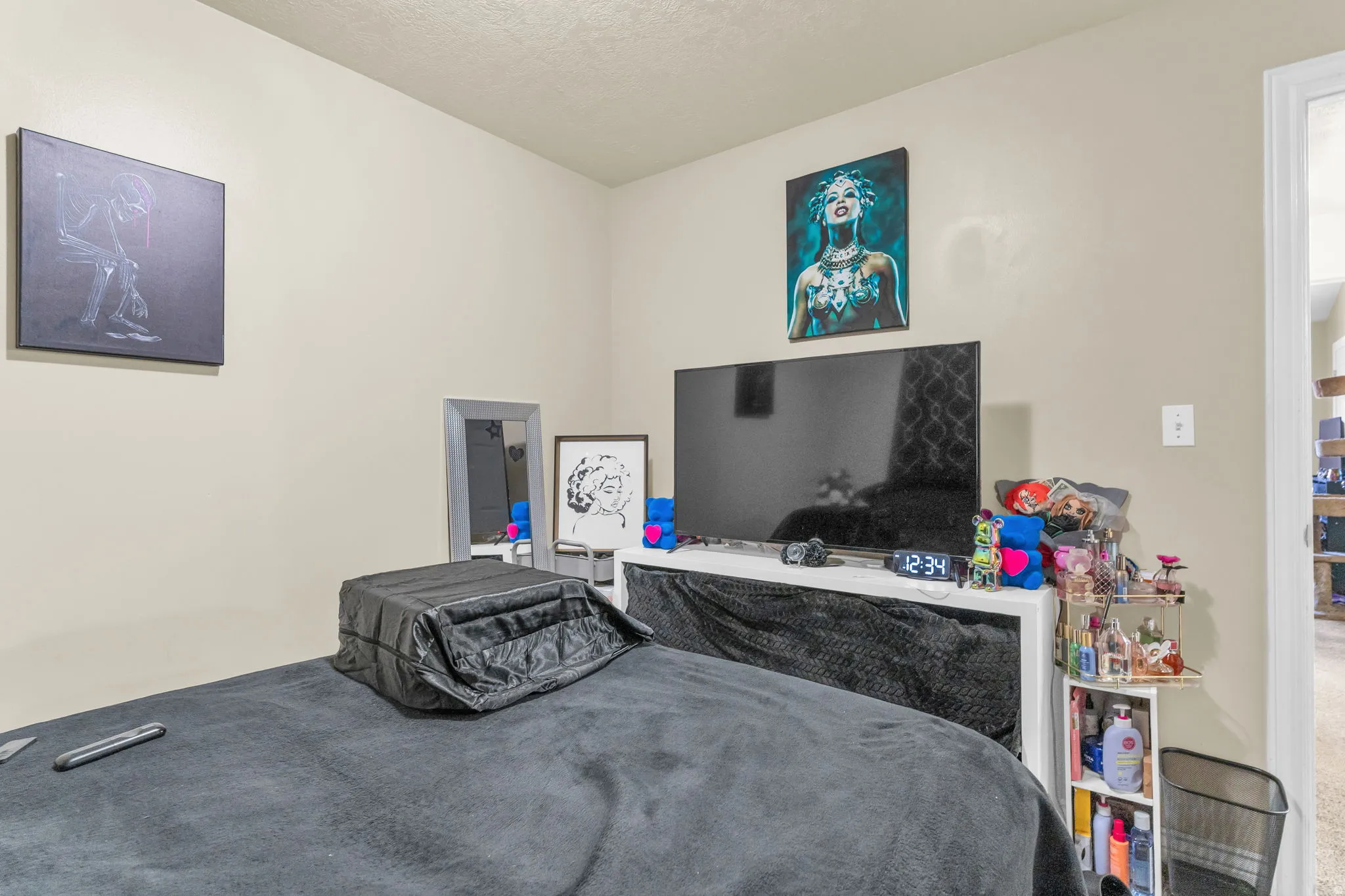 Neutral-toned walls complement the carpeted flooring