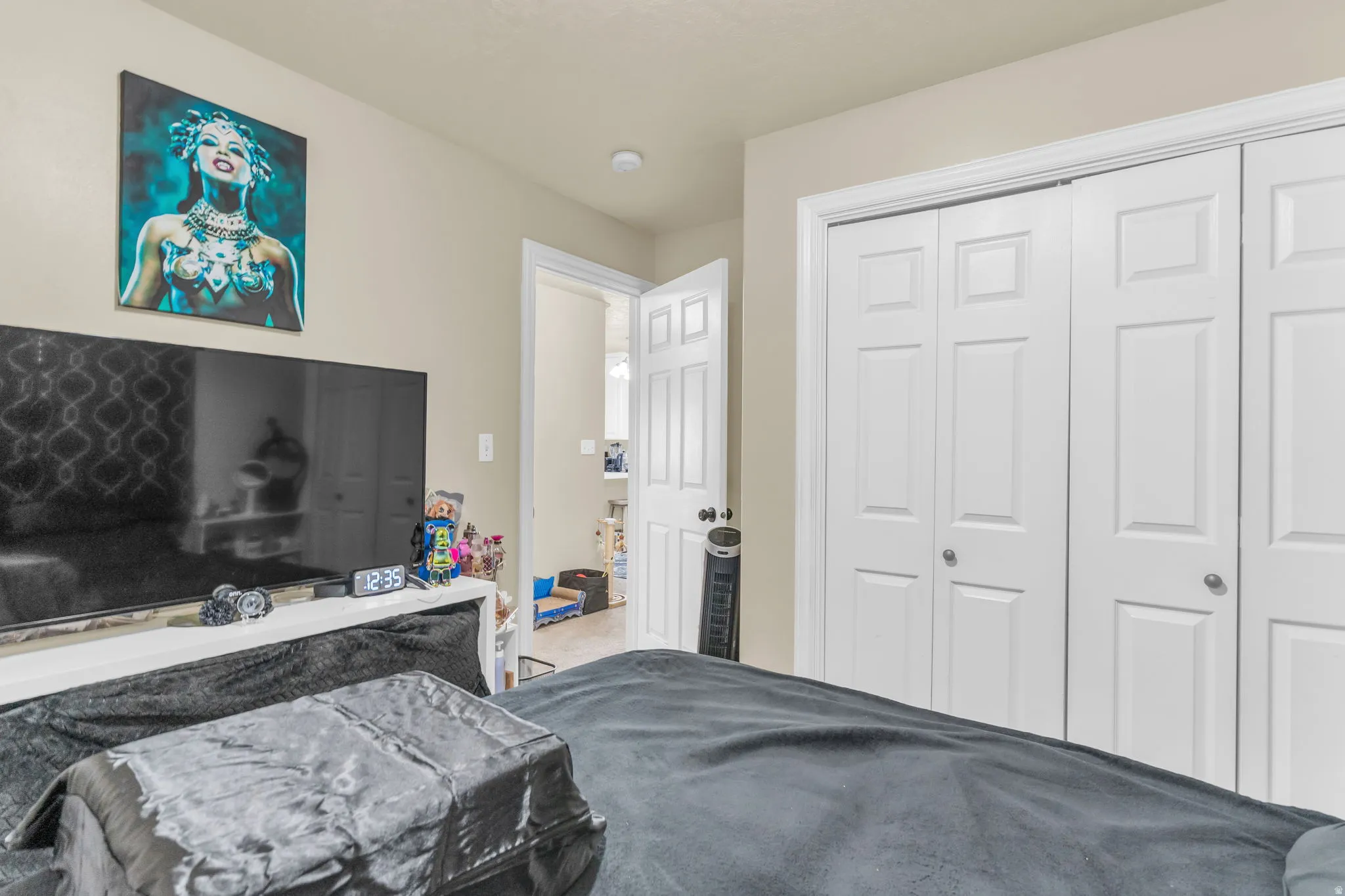 Double bi-fold closet doors with white paneling