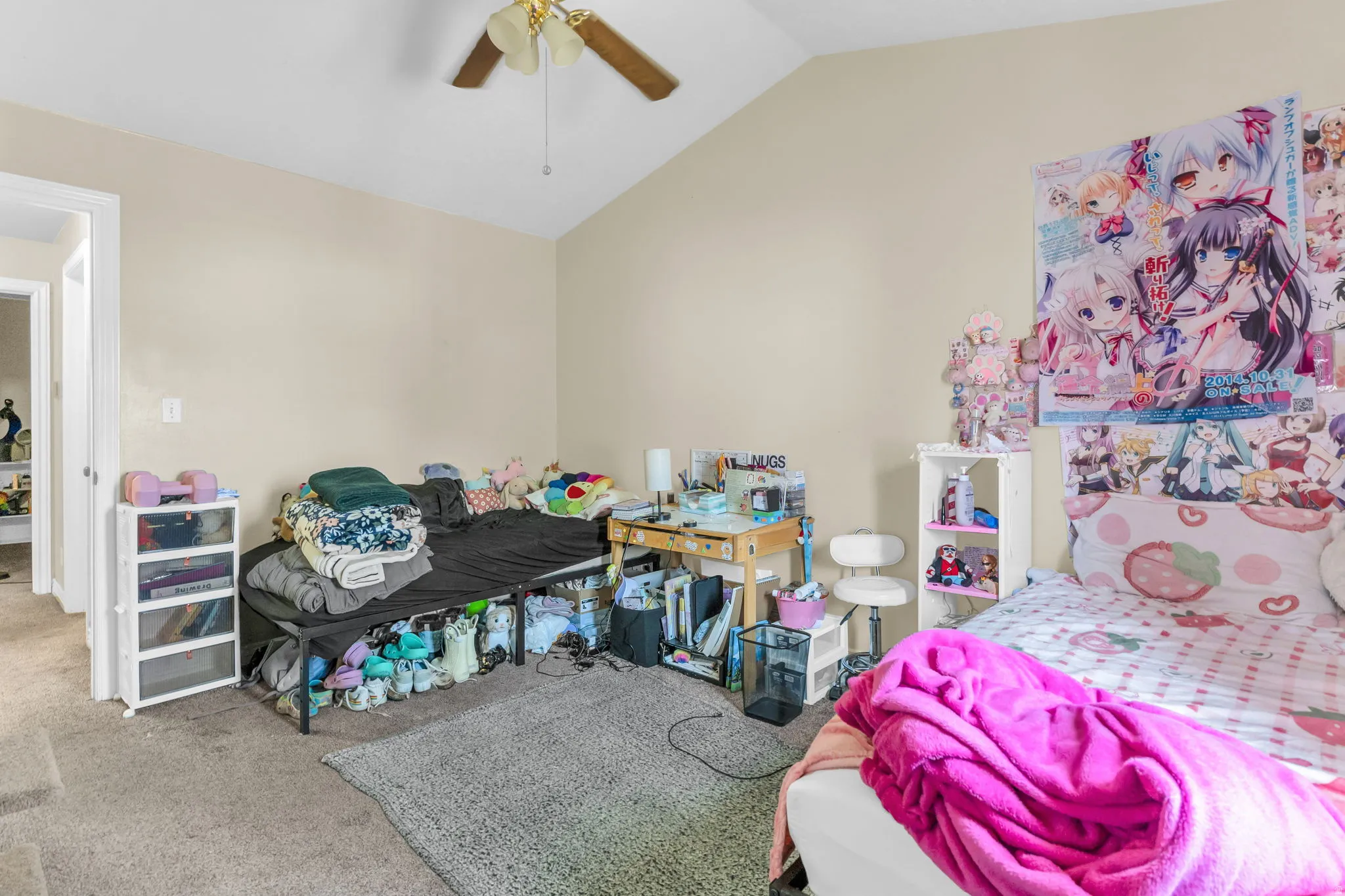 Interior room featuring a vaulted ceiling with a ceiling fan