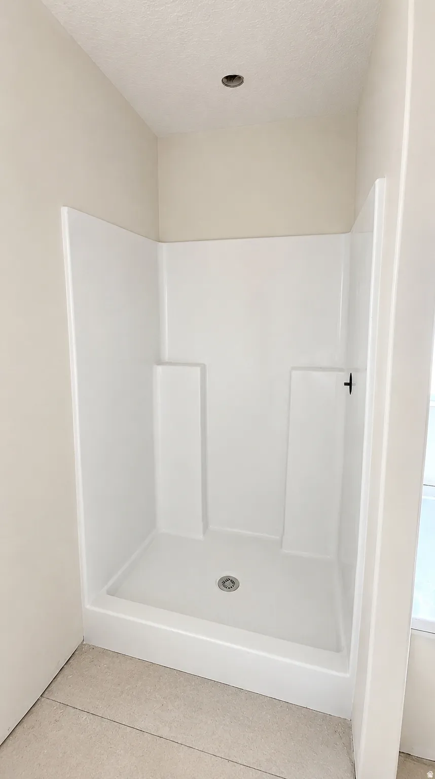 Shower separate from soaker tub