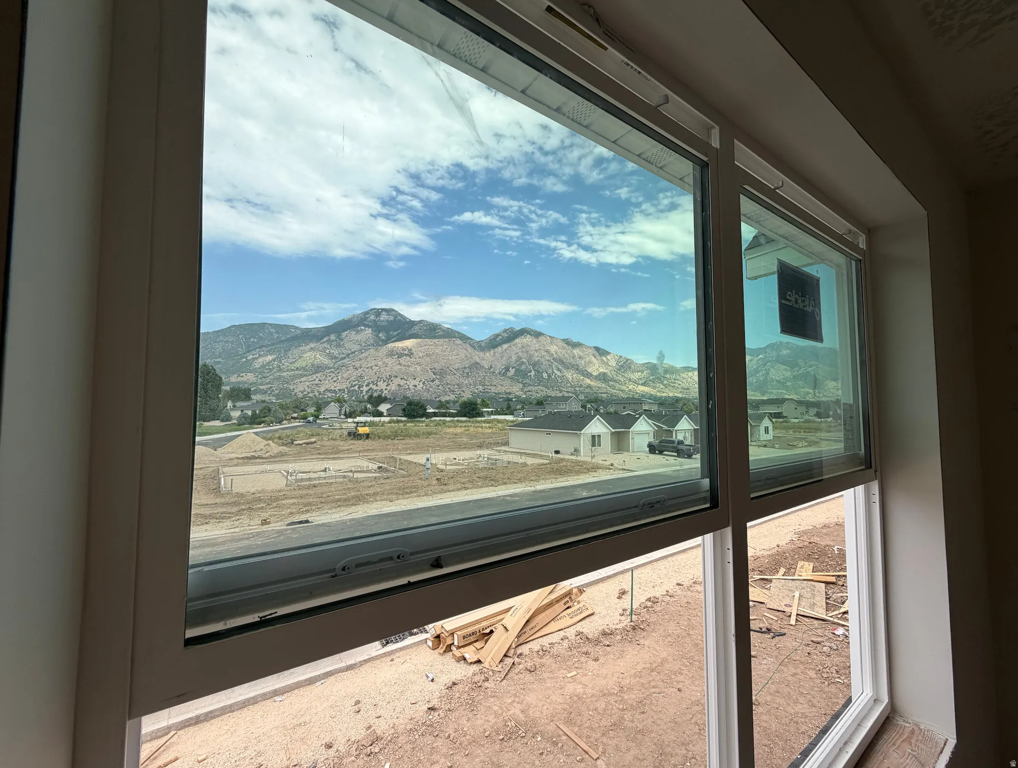 Expansive window framing beautiful mountain backdrop