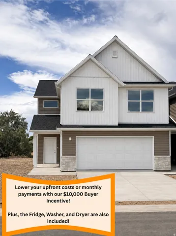 Two-story residence featuring a two-car garage, concrete driveway, and mixed material siding