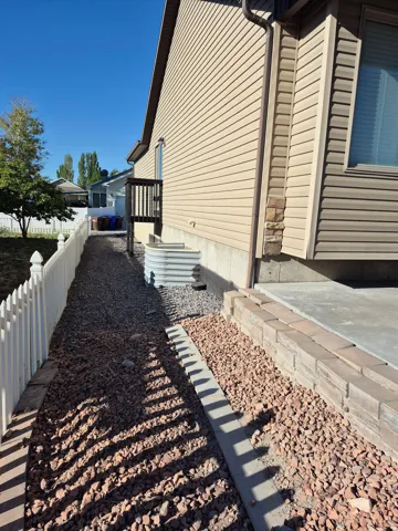 Exterior siding in a neutral tone with contrasting trim