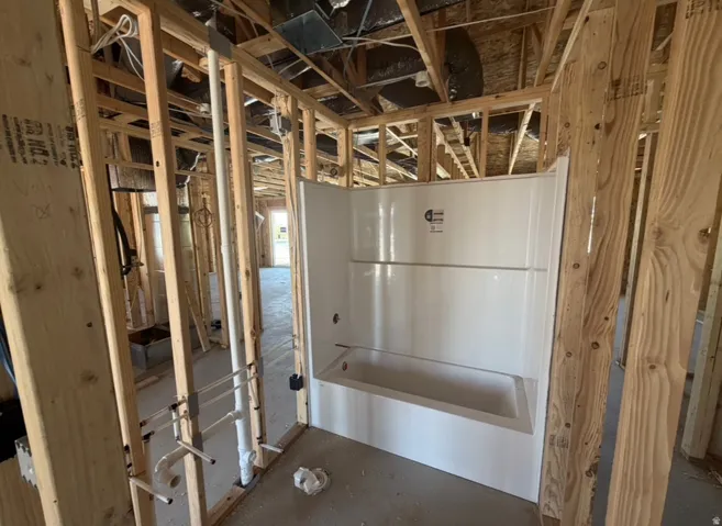 New construction framing with a pre-installed tub and shower unit