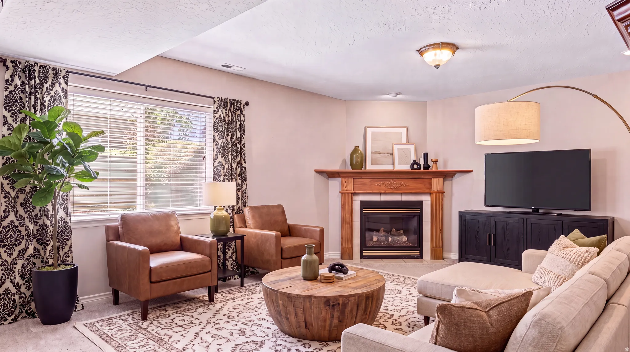 Virtually designed room to show the neutral bones of the home can carry many decor options. Continuous taupe paint virtually added for perspective