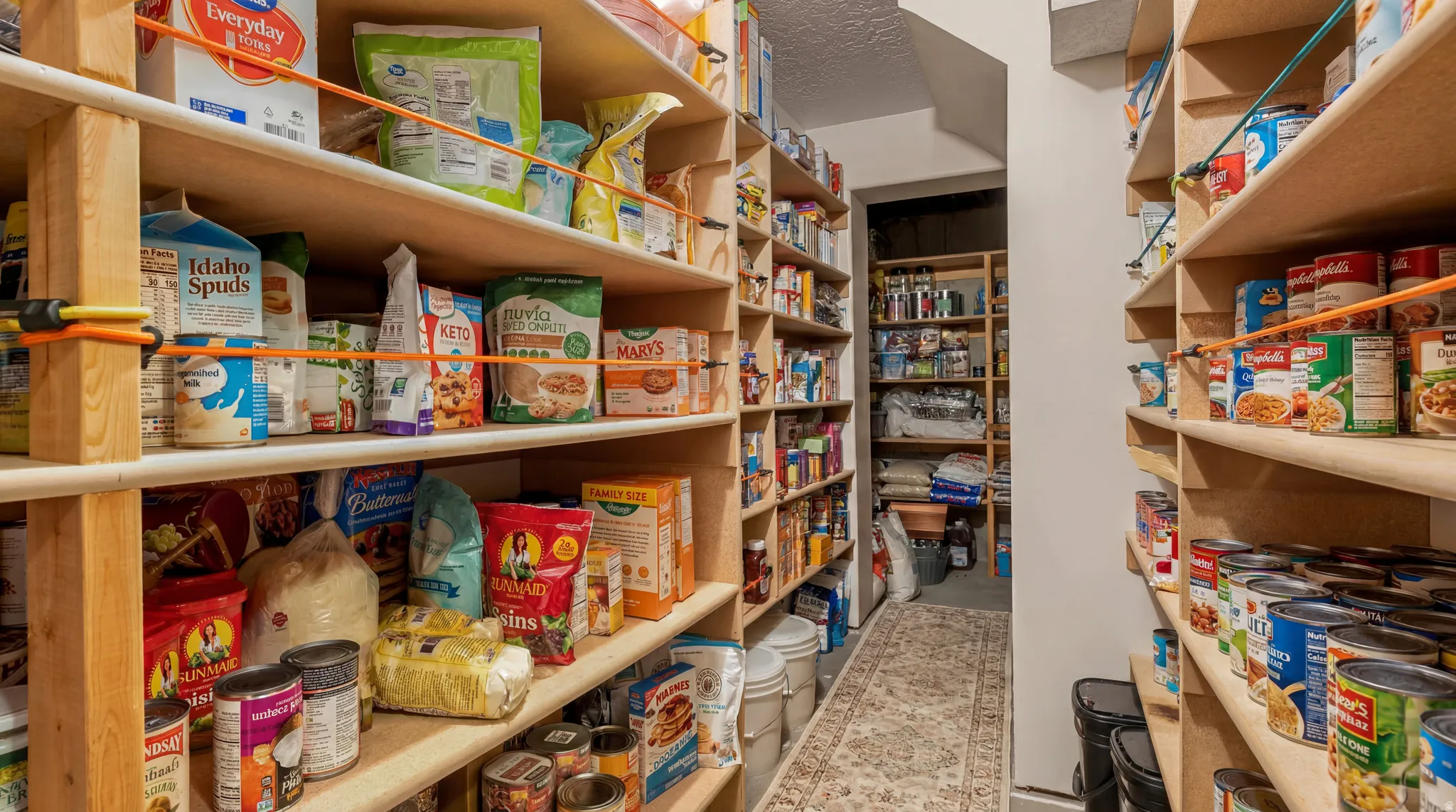 large walk in cold storage located just off the stairway