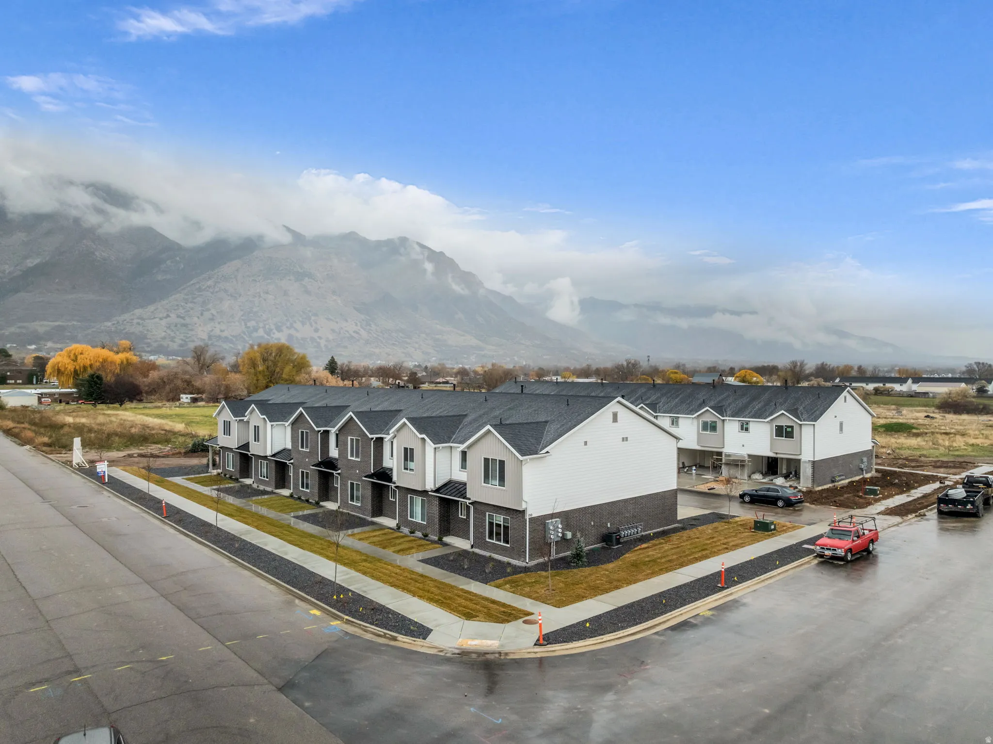Modern townhome development featuring a multi-story design with contrasting siding