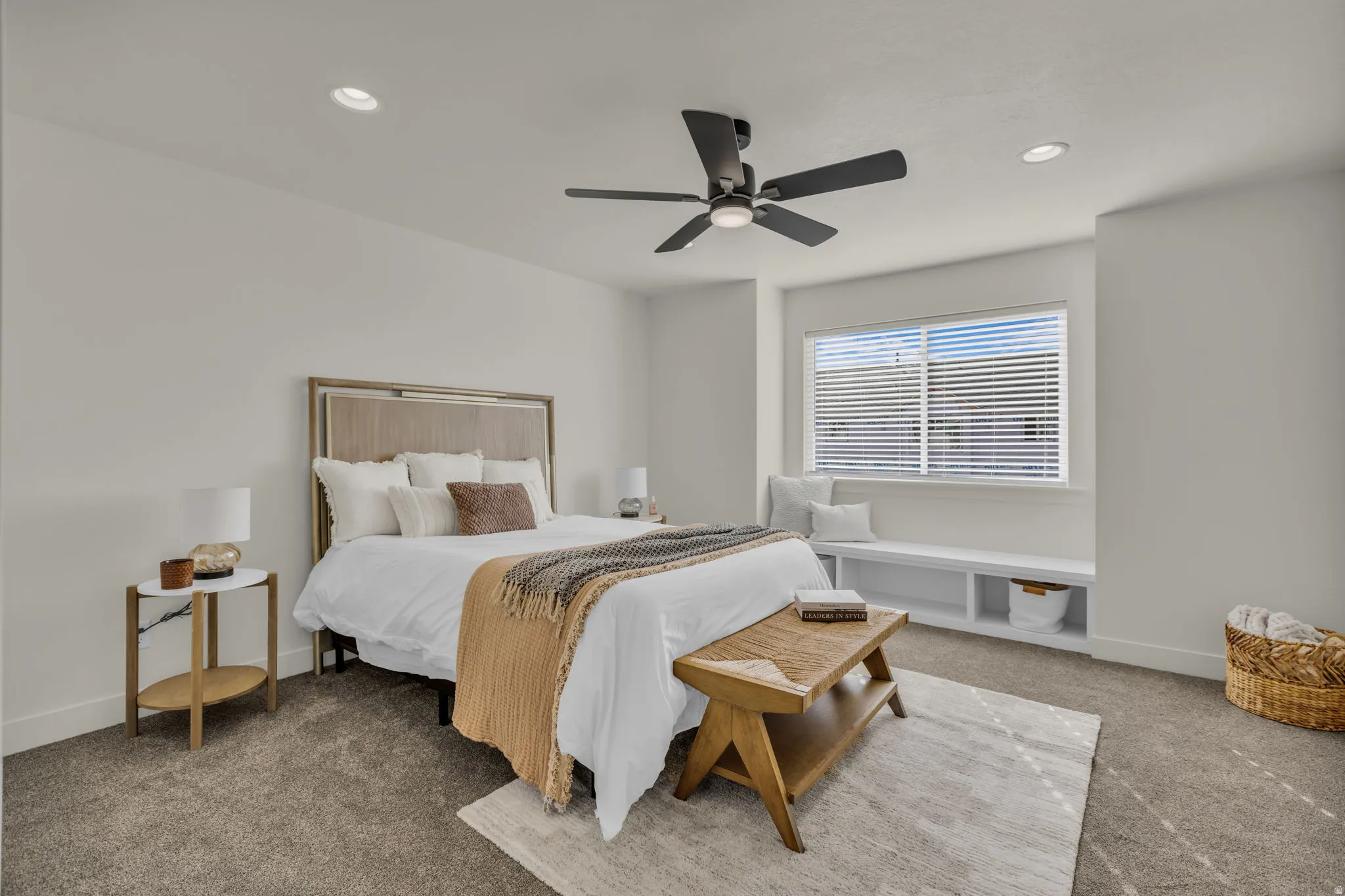 Carpeted room featuring a ceiling fan with integrated lighting, recessed lighting, and a window with blinds