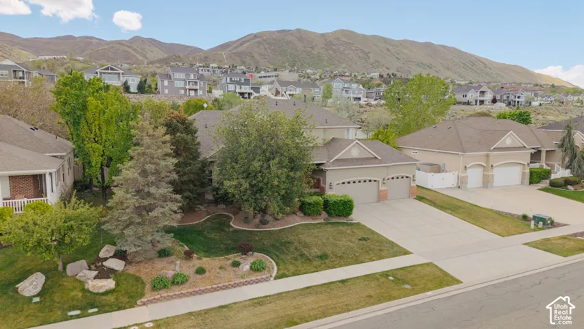 Two-story residence with a two-car garage and a paved driveway