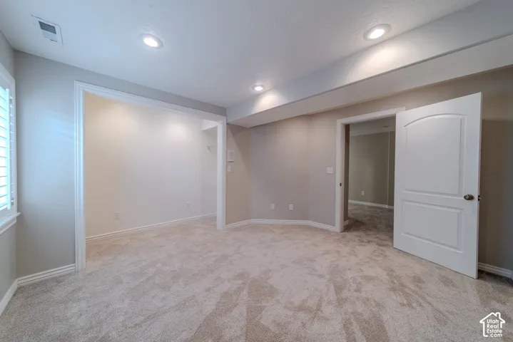 Neutral-toned carpeting throughout