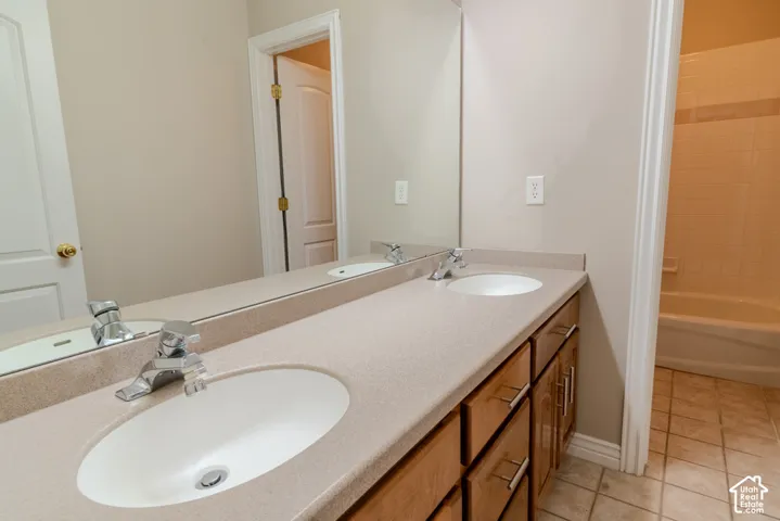 Double vanity with integrated sinks and stone-finish countertop
