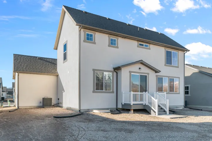Rear exterior with a covered patio featuring a sliding glass door