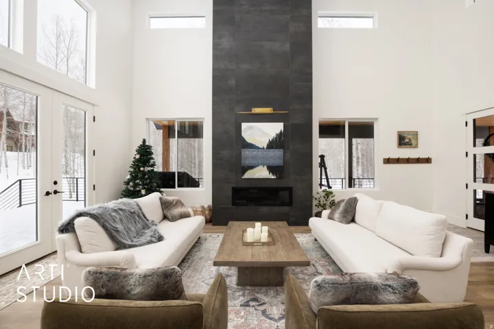 Dramatic floor-to-ceiling fireplace featuring dark tile surround and a linear hearth