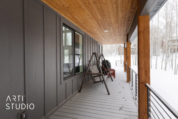 Porch featuring a tongue-and-groove wood ceiling, recessed lighting, and a board and batten exterior wall