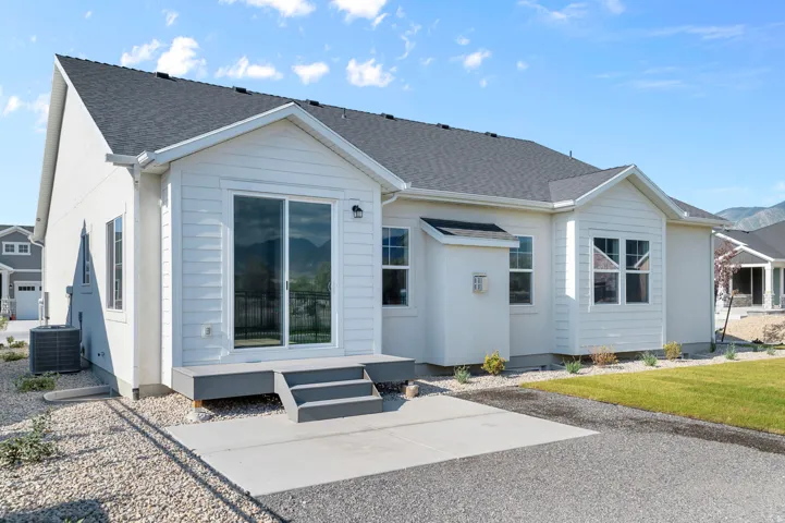 White exterior with dark shingle roofing