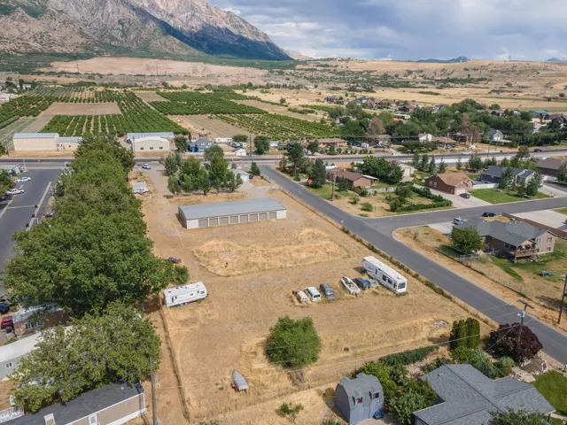 Expansive undeveloped land parcel featuring a large storage building