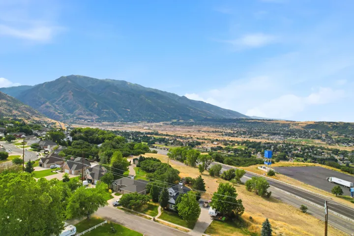 Expansive valley setting with a prominent mountain backdrop