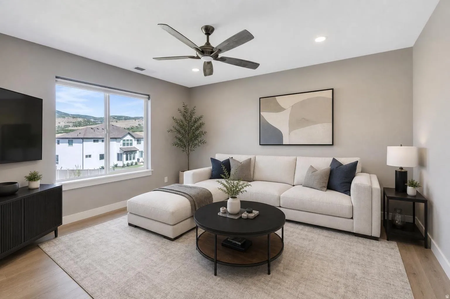 Virtual Staging. Loft area featuring a large window, light wood-finish flooring, recessed lighting, and a ceiling fan