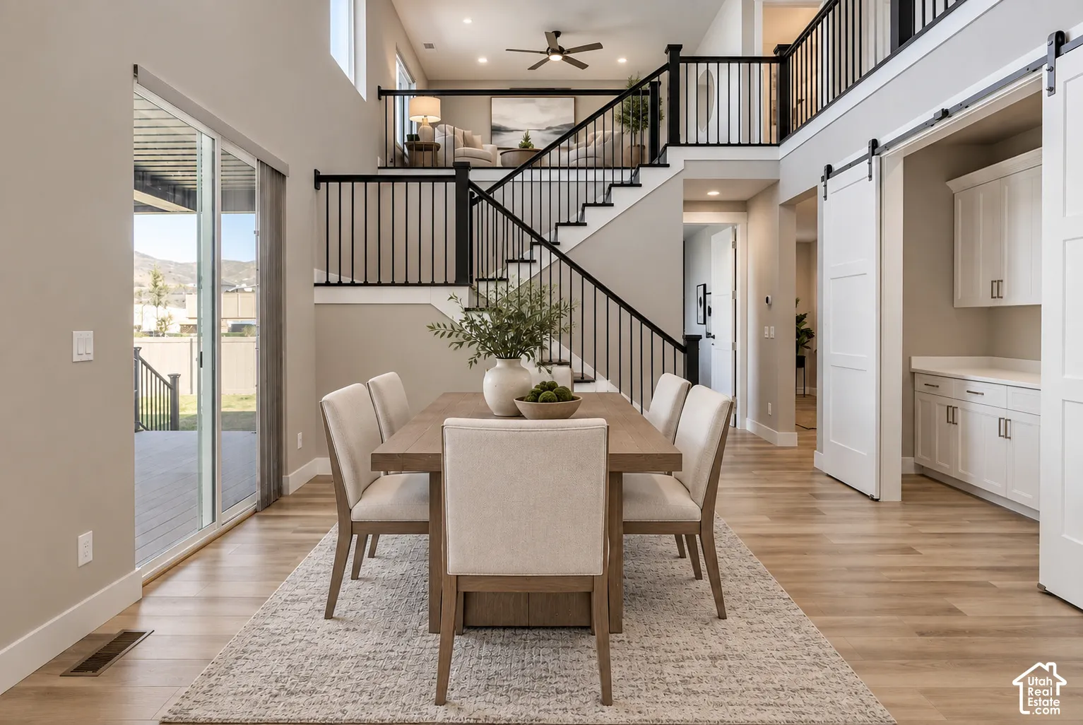 Open-concept dining area with wood-finish flooring