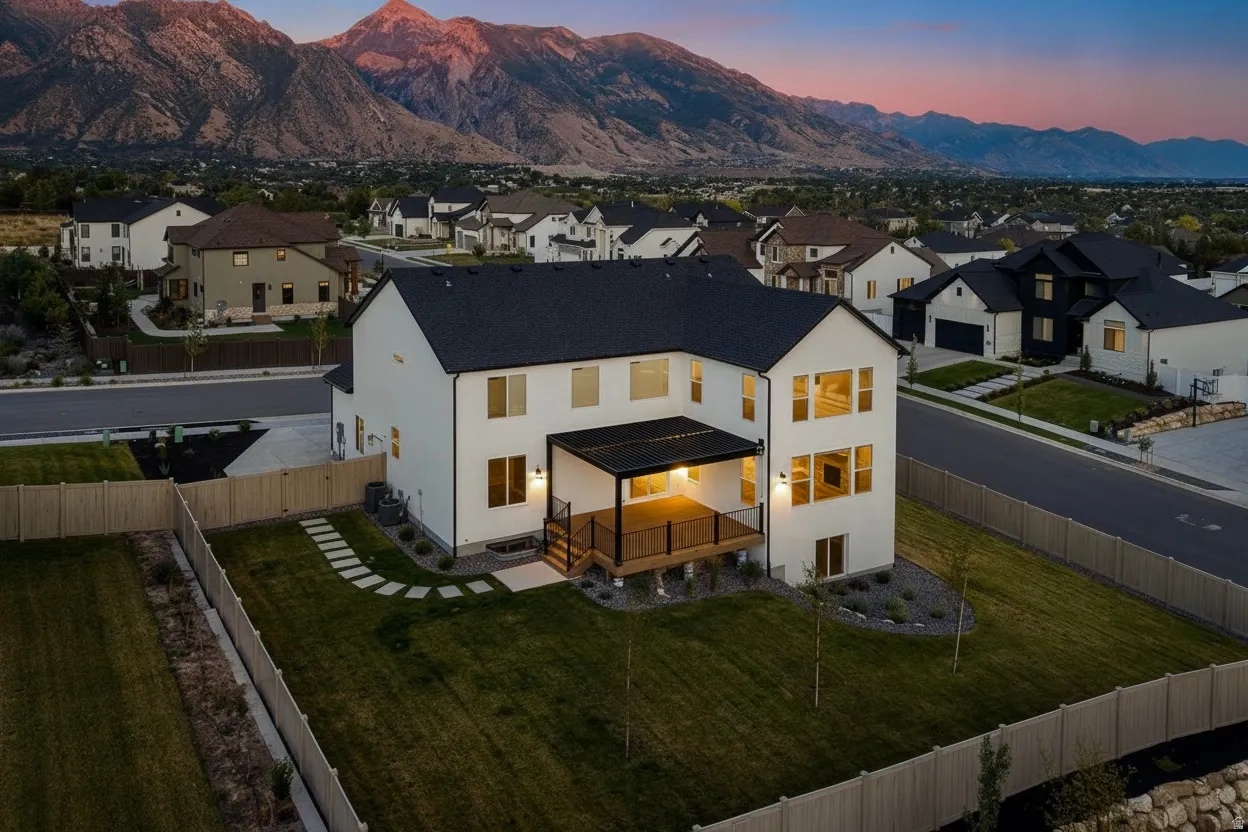 Contemporary residence featuring a spacious backyard with a manicured lawn