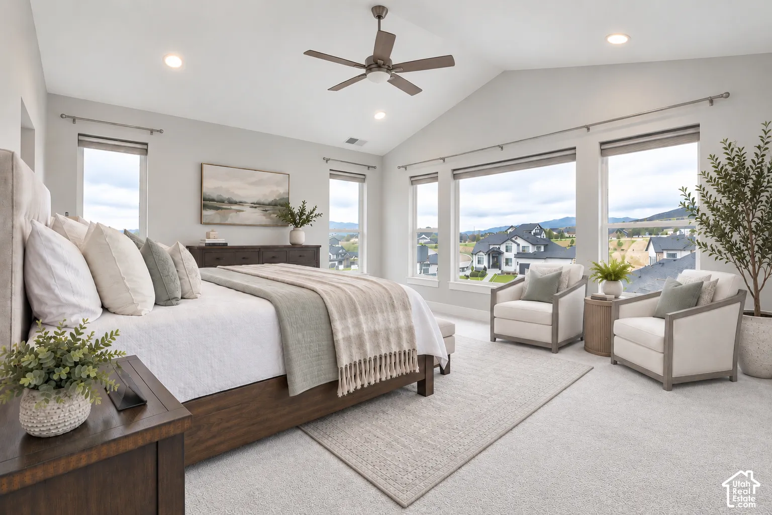 Vaulted ceiling with a ceiling fan, recessed lighting, expansive windows, wood-finish flooring, and soft carpeting