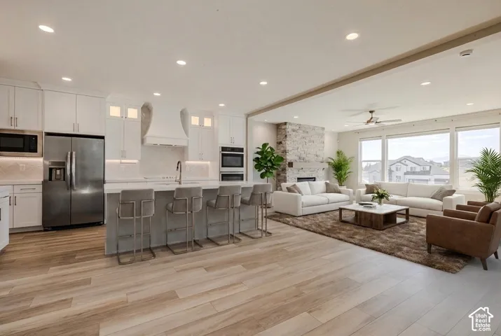 Virtual Staging. Open-concept living space featuring wood-finish flooring