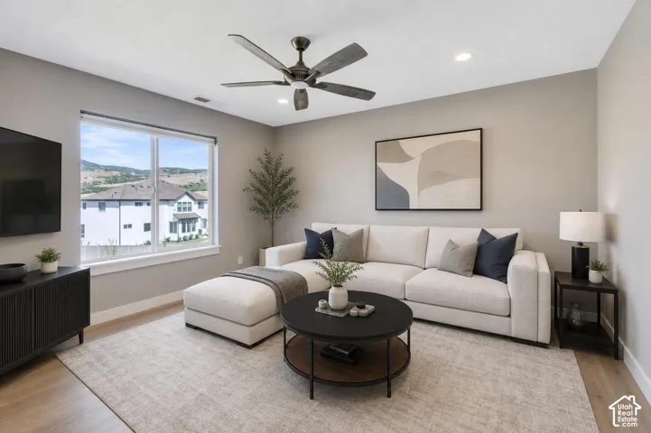 Virtual Staging. Loft area featuring a large window, light wood-finish flooring, recessed lighting, and a ceiling fan