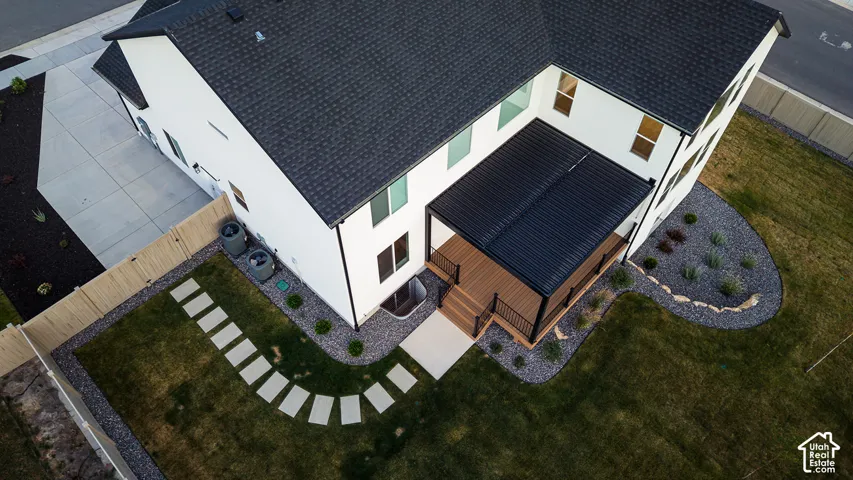 Modern white exterior with dark roof and trim accents