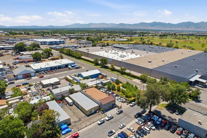 Industrial park setting featuring multiple commercial buildings with flat roofs