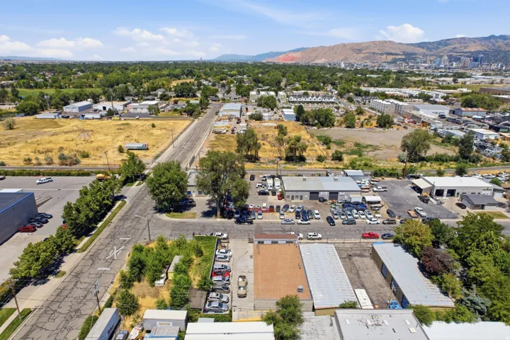 Aerial perspective showcasing commercial properties with expansive paved areas