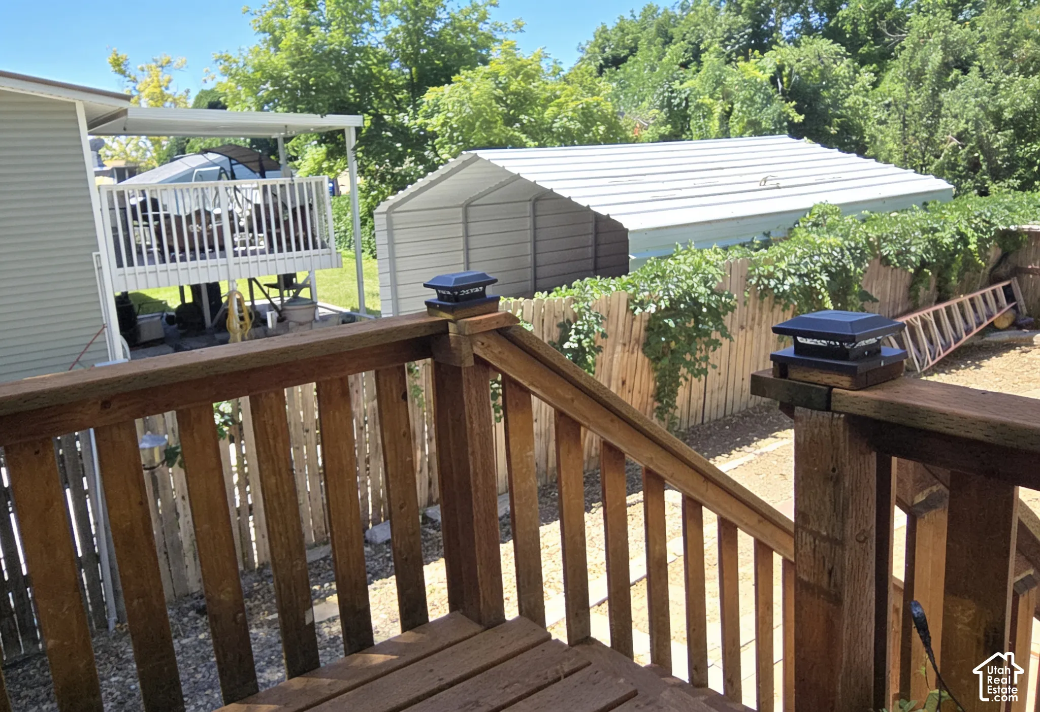 Wood deck with integrated solar post caps, providing exterior illumination