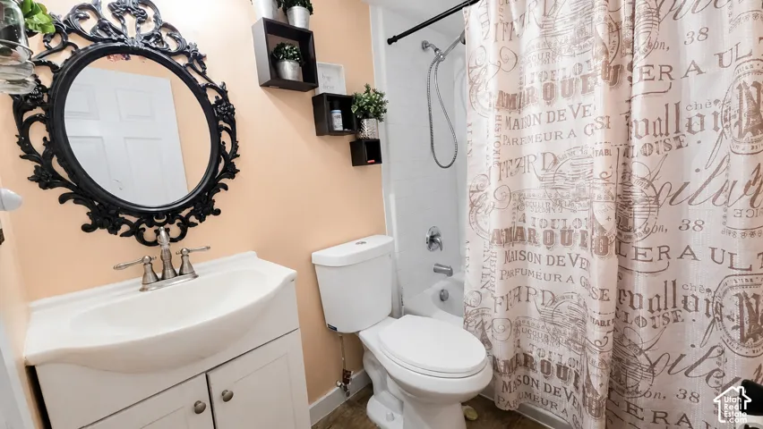 Bathroom featuring a white vanity with integrated sink