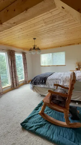 Vaulted wood-paneled ceiling with exposed beams